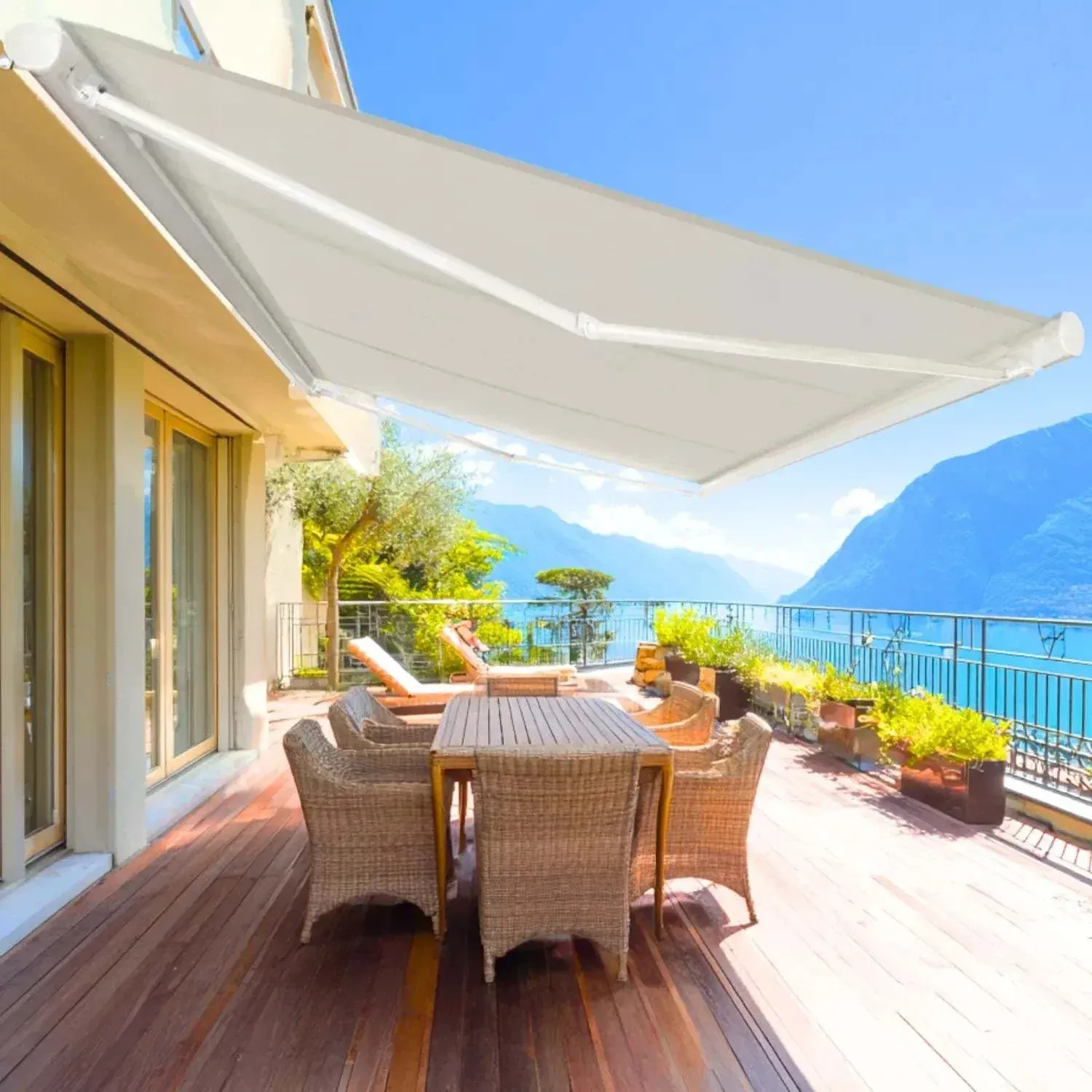 Motorized retractable awning extended over a patio providing shade